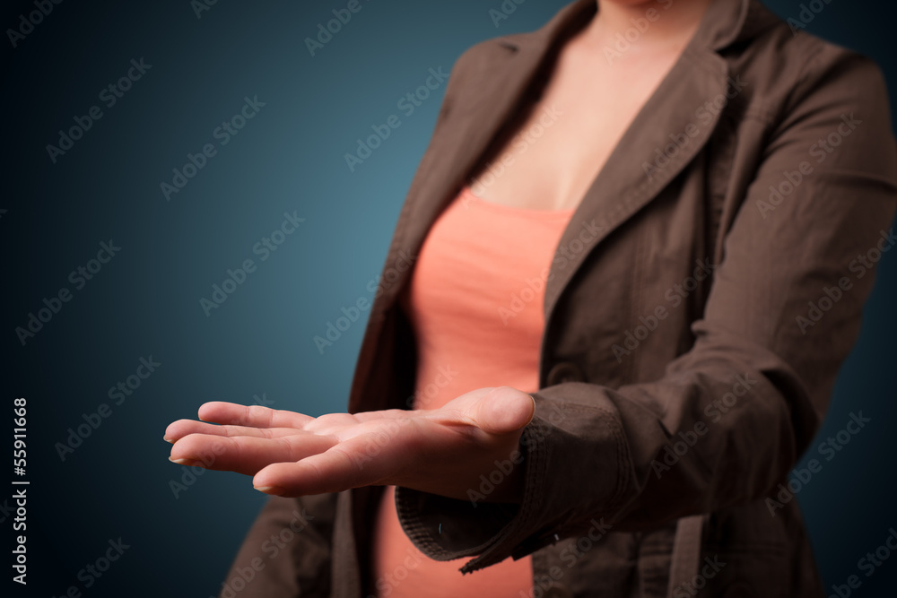 Young girl presenting with hand copy space Young girl presenting with hand copy space