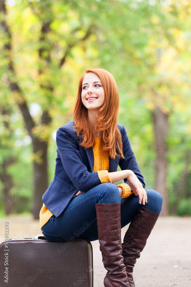 Girl with suitcase at autumn outdoor Girl with suitcase at autumn outdoor