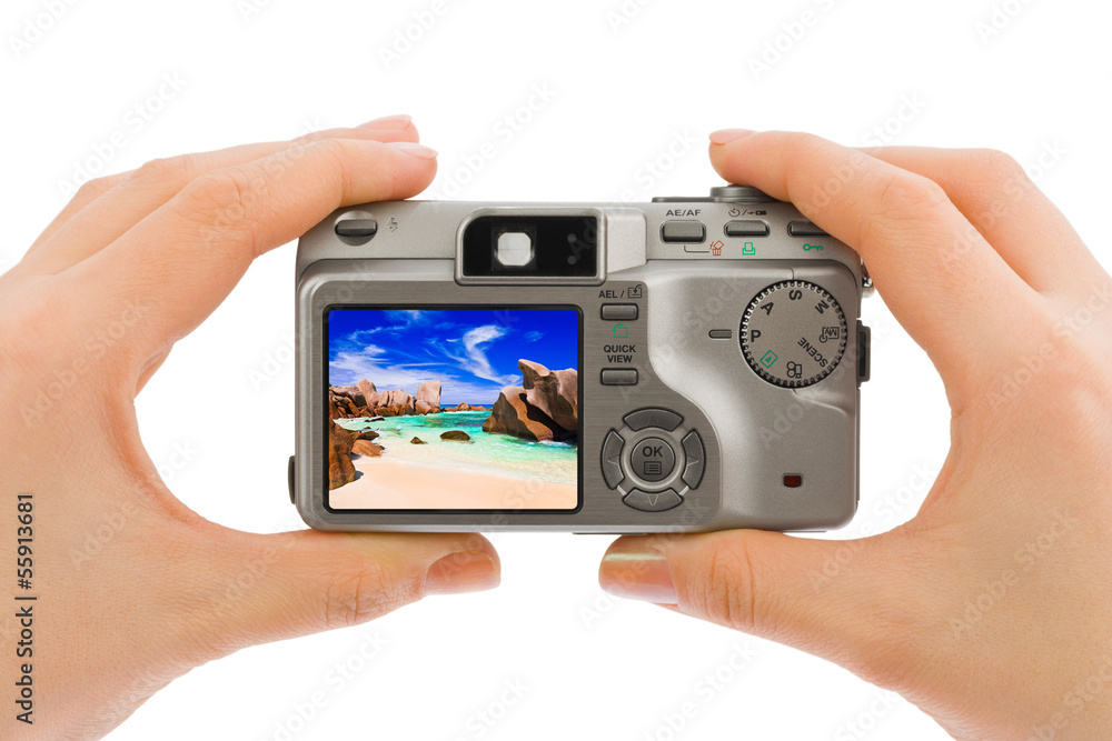Hand with camera and beach landscape (my photo) Hand with camera and beach landscape (my photo)