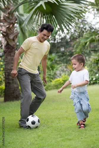Playing football © DragonImages