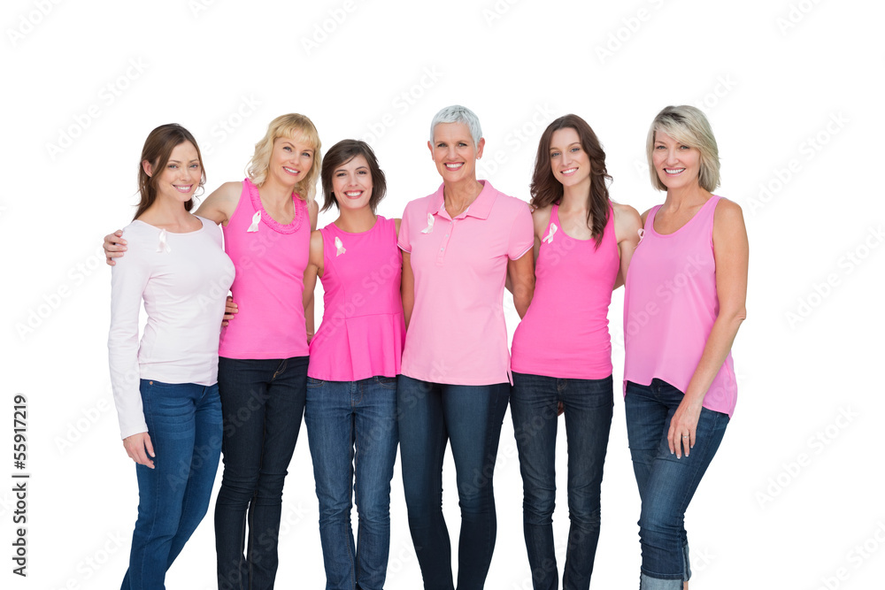 Obraz premium Smiling women wearing pink for breast cancer awareness