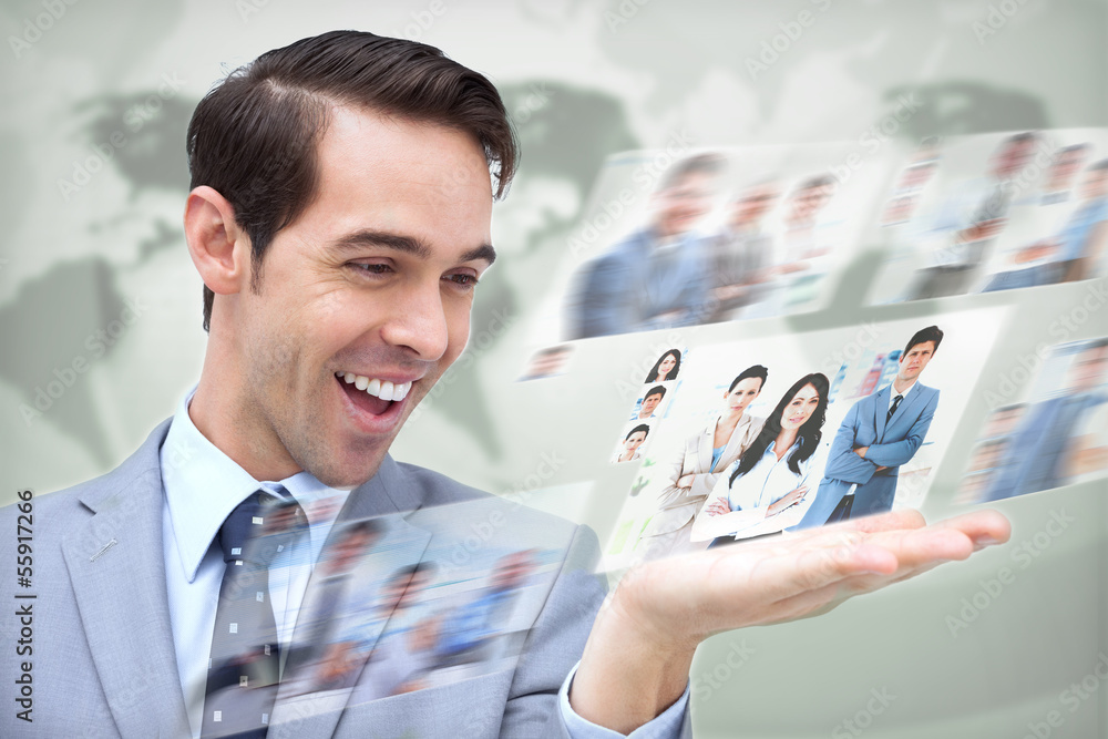 Content businessman looking at pictures Content businessman looking at pictures