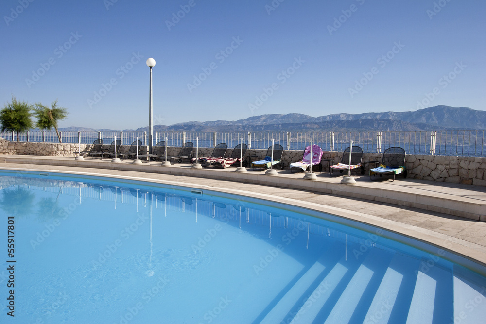 Hotel swimming pool near the sea on island Brac in Croatia
