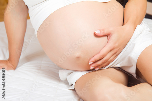 Pregnant woman, closeup belly