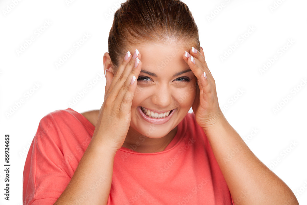 Shy girl. Beautiful young woman smiling and holding head in hand Shy girl. Beautiful young woman smiling and holding head in hand