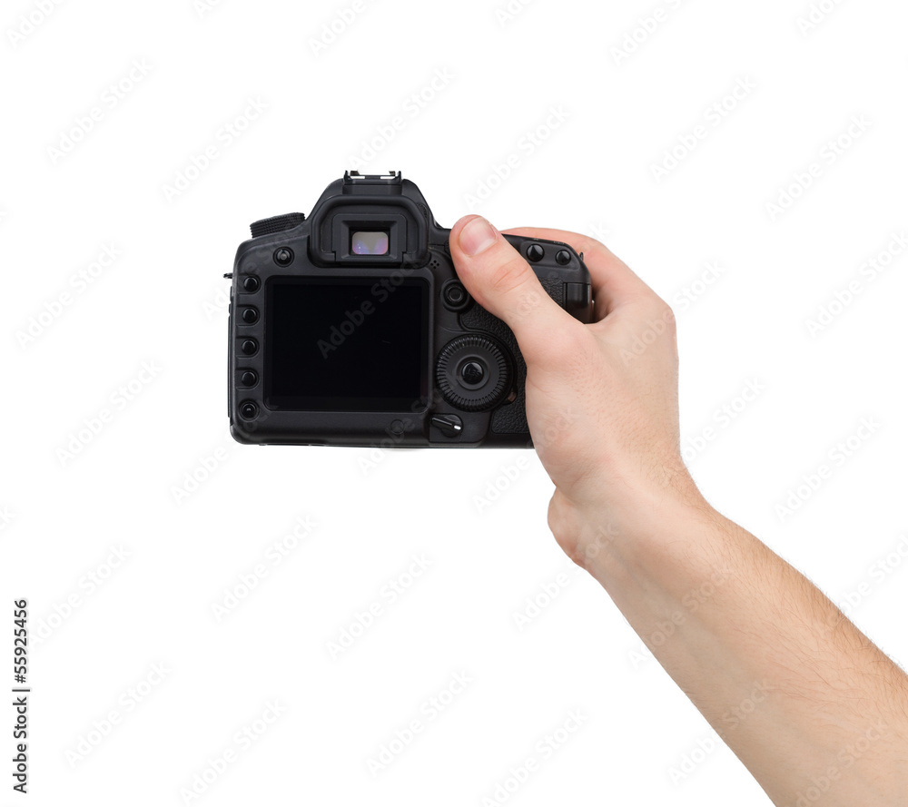 Camera in hand. Close-up of hand holding camera while isolated o Camera in hand. Close-up of hand holding camera while isolated o