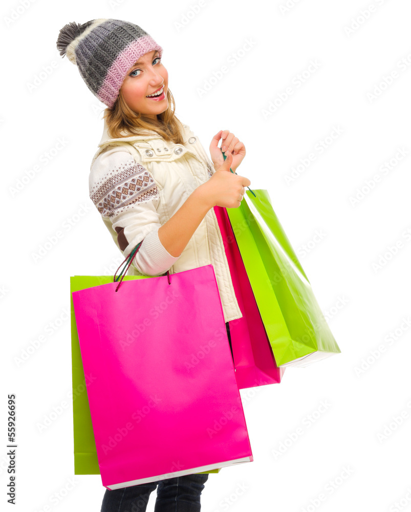 Young girl with bags shows ok gesture Young girl with bags shows ok gesture
