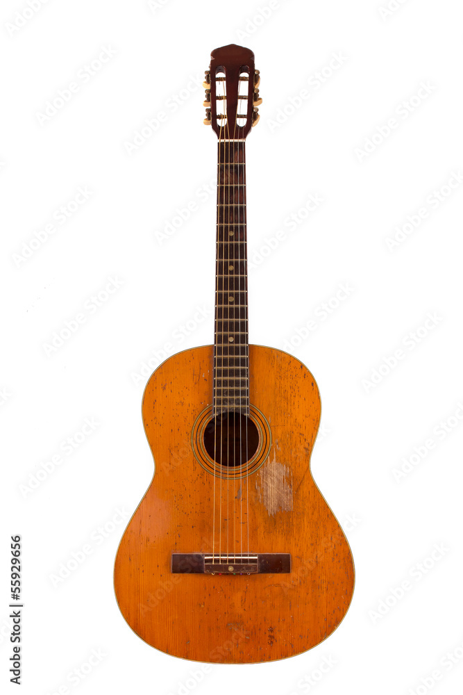 Old acoustic guitar on white background