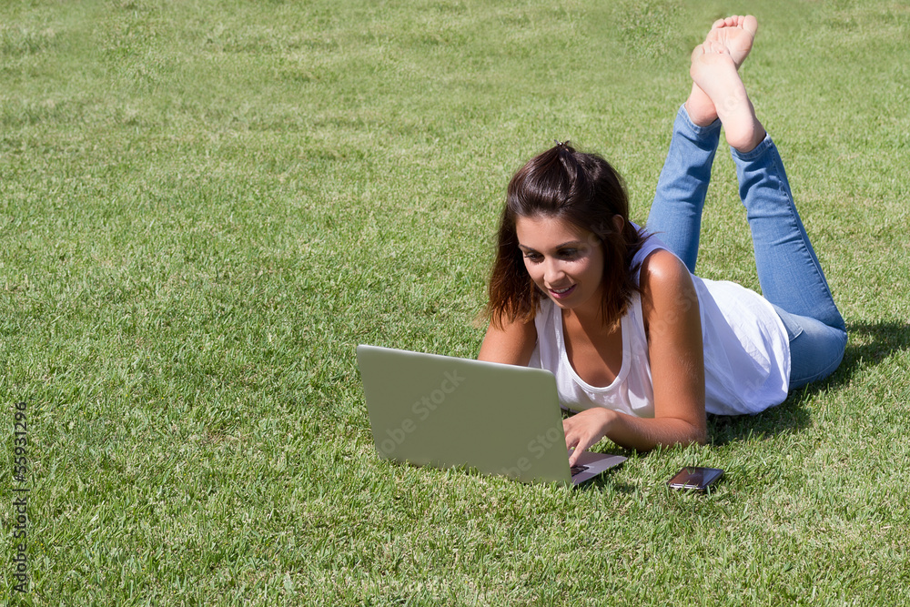 Smiling woman using laptop Smiling woman using laptop