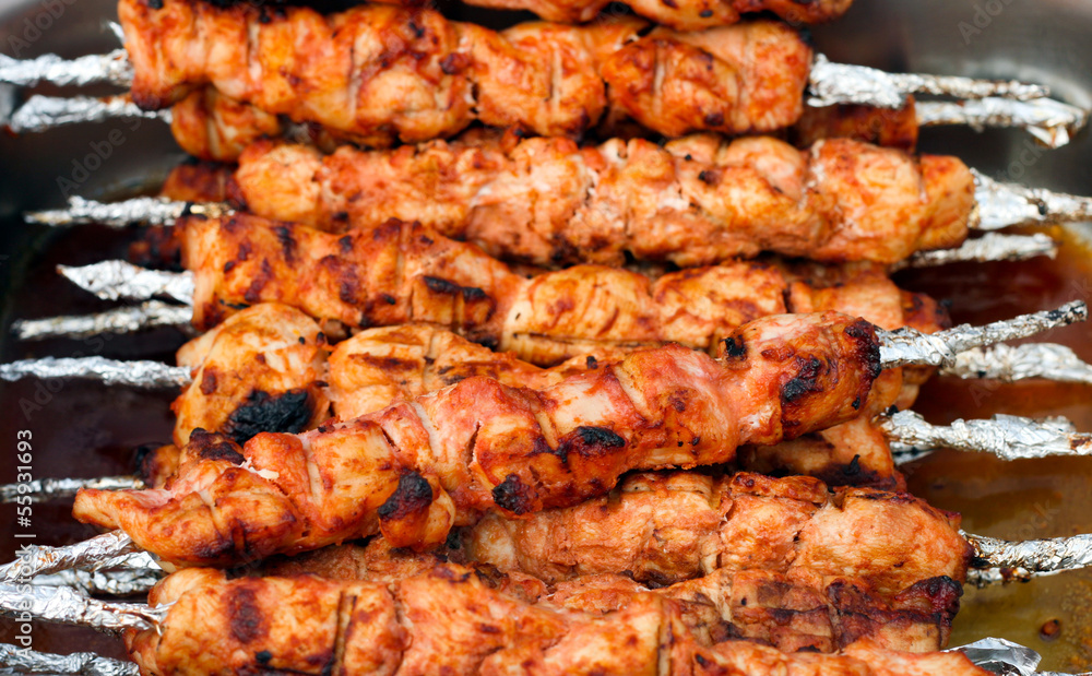 Many roast meat on skewers portions