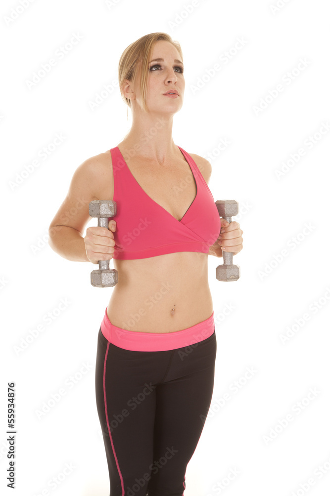 Woman fitness pink bra tattoo weights side