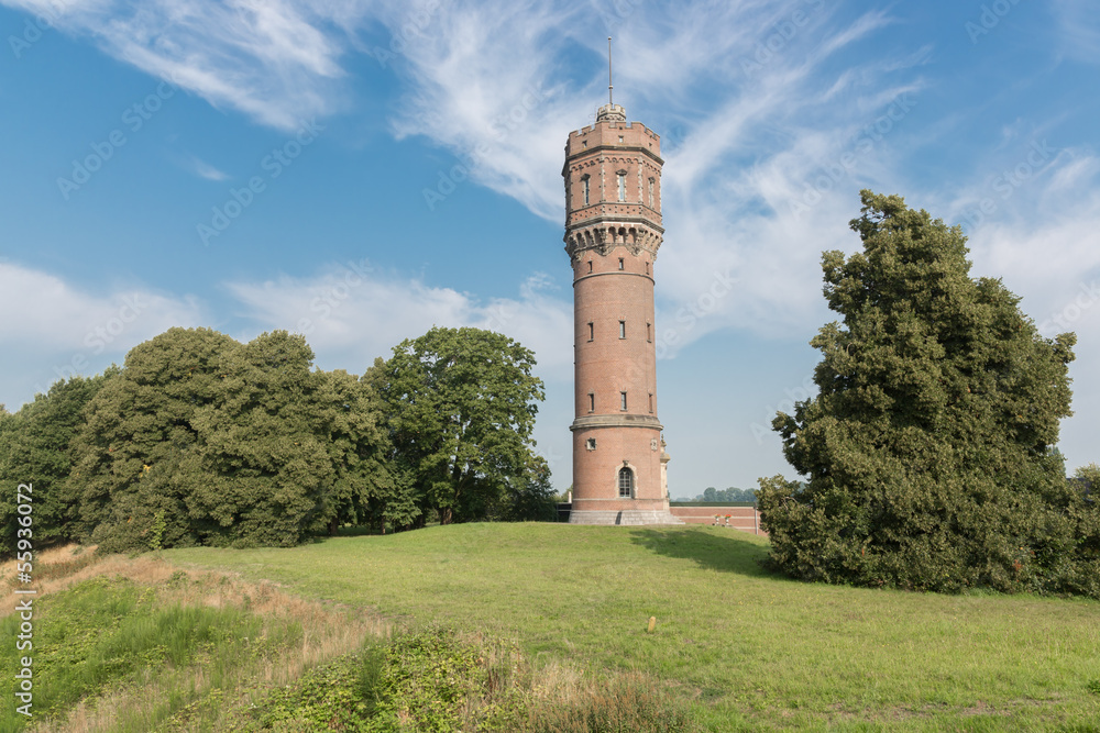 Old Dutch water tower in rural landscape