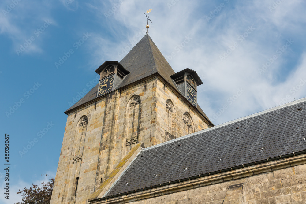 Dutch church with tower against a blue sky