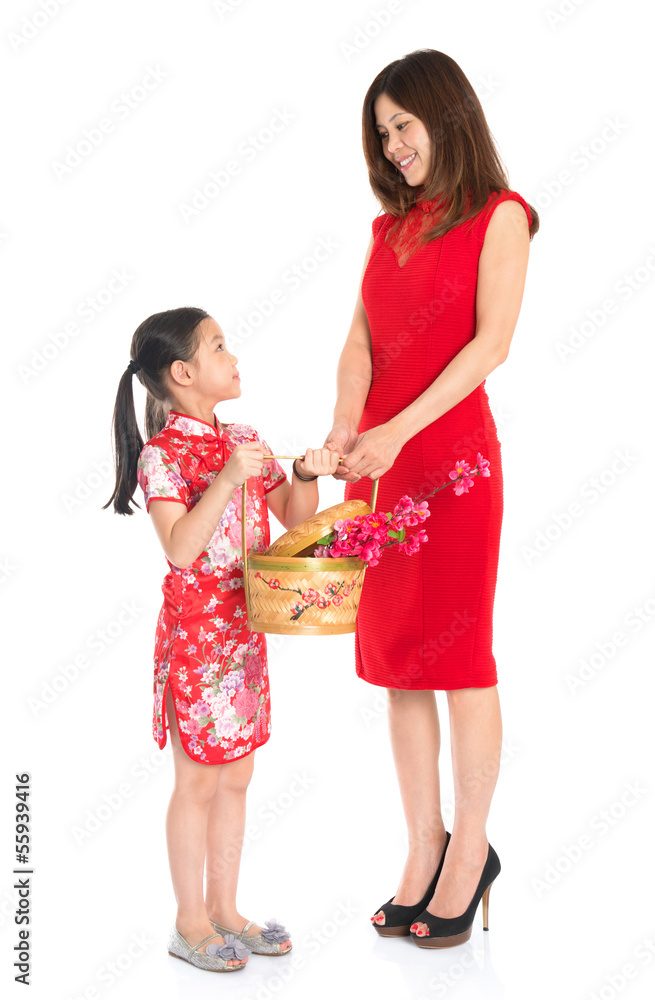 Chinese family holding a gift basket Chinese family holding a gift basket