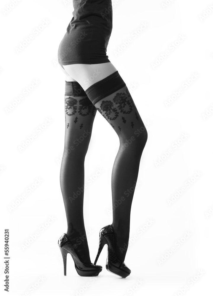 Wunschmotiv: Beautiful legs in sexy stockings isolated on a white background #55940231