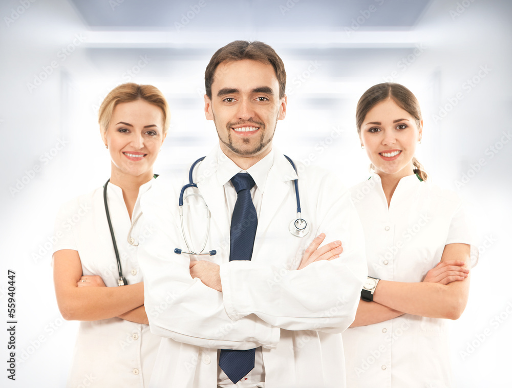 A team of young and smart medical workers in white clothes A team of young and smart medical workers in white clothes