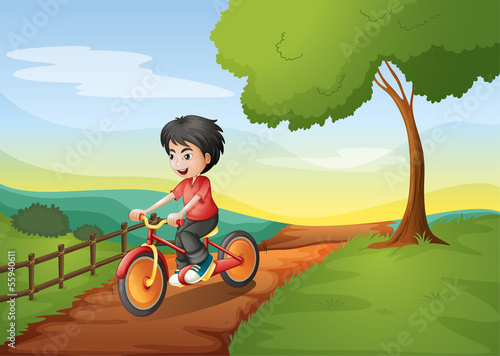 A happy boy biking