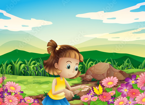 A girl catching the butterfly at the garden
