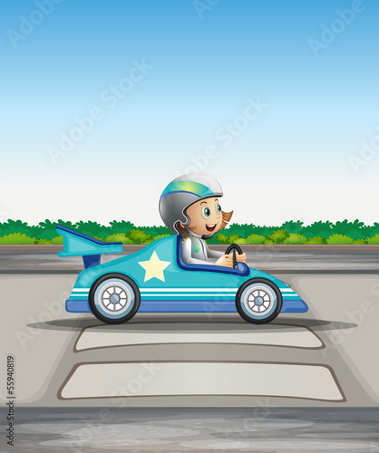 A female racer in her blue racing car