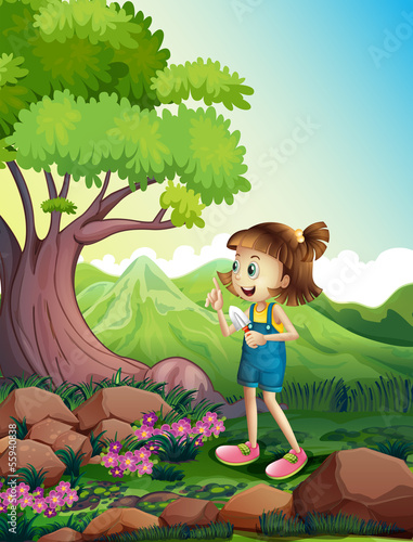 A girl holding a shovel at the forest