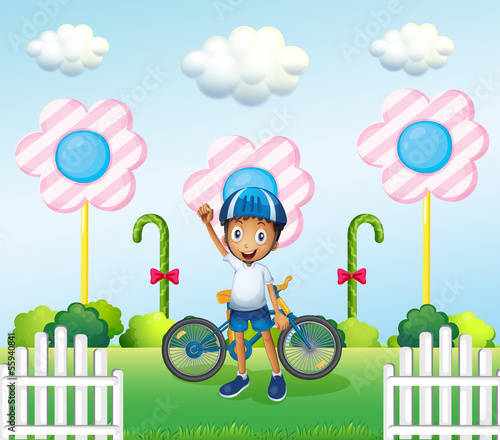 A happy boy at the candyland with his bike