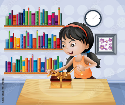 A girl unwrapping a present at the table