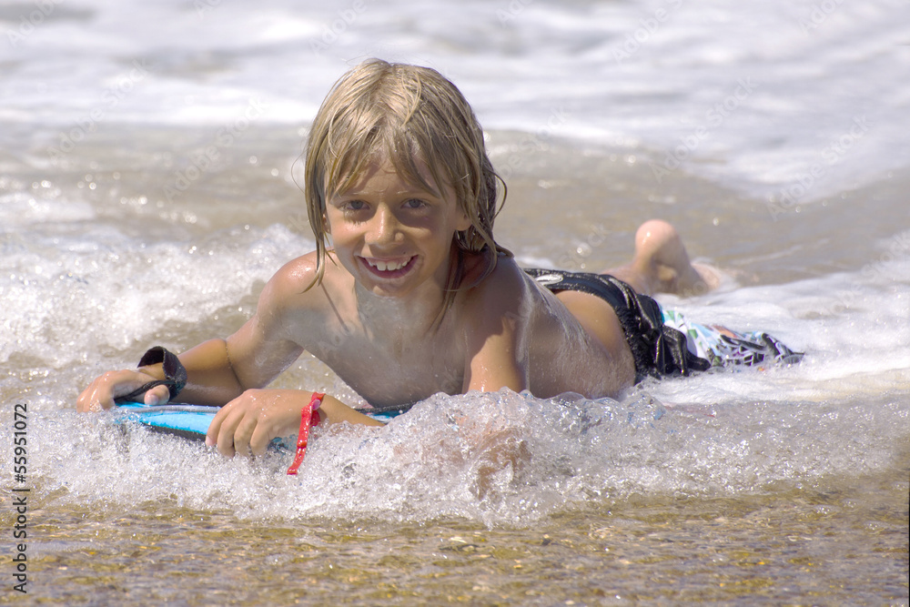 a boy with a body board