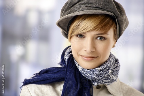 Attractive young woman in cap