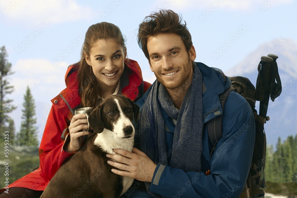 Trekkers with dog taking rest Trekkers with dog taking rest
