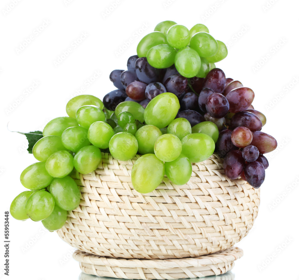 Ripe green and purple grapes in basket isolated on white Ripe green and purple grapes in basket isolated on white