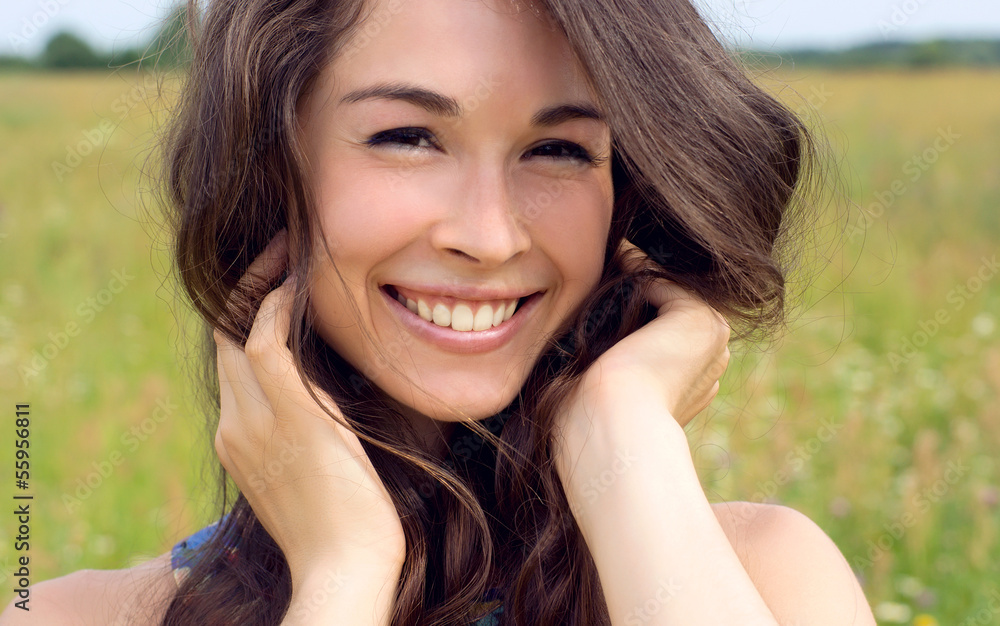 Happy young beautiful woman in field Happy young beautiful woman in field