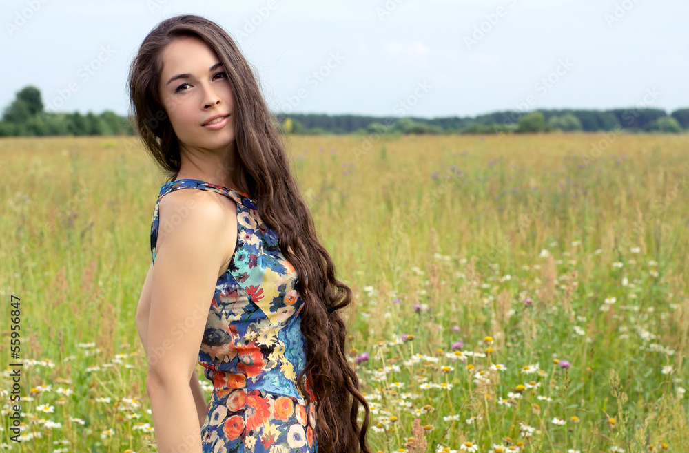 Happy young beautiful woman in field Happy young beautiful woman in field