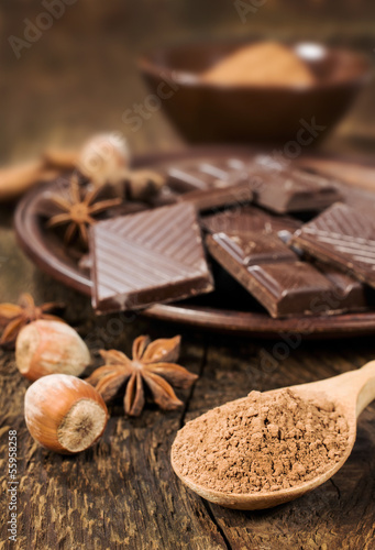 chocolate, nuts and cocoa powder close up