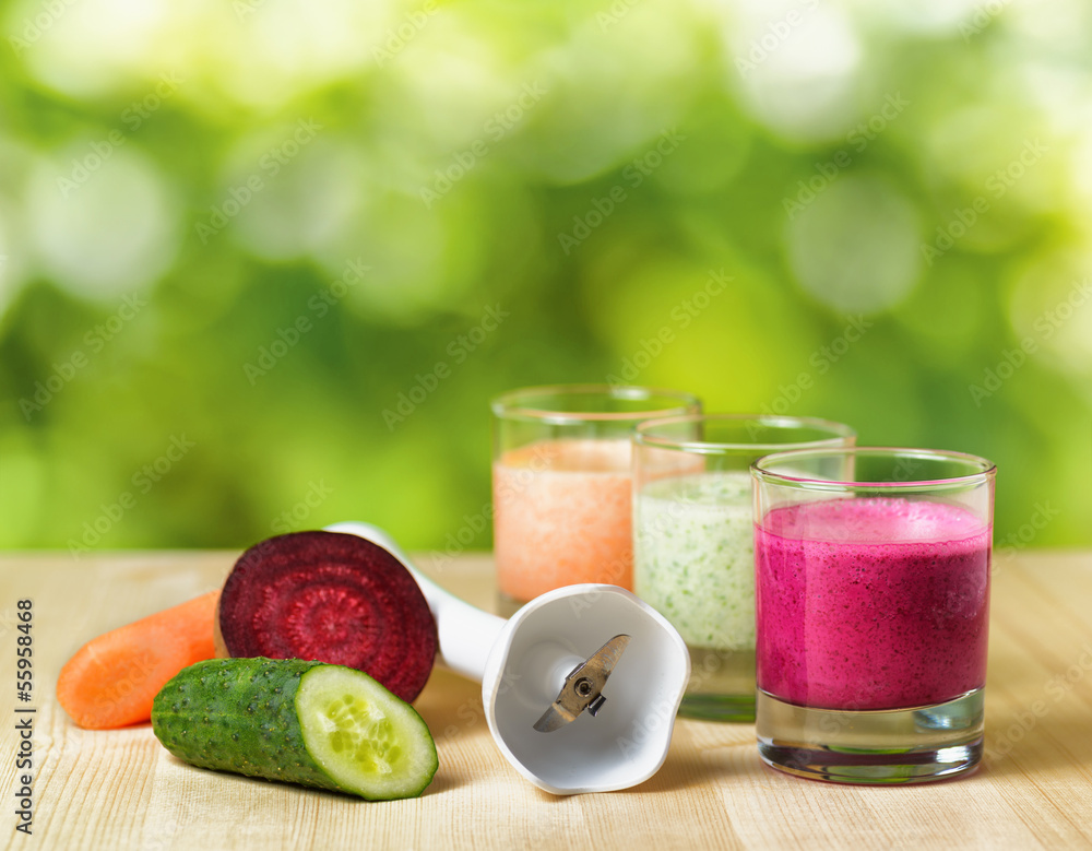 Vegetable smoothie on wooden table on the rural background Vegetable smoothie on wooden table on the rural background