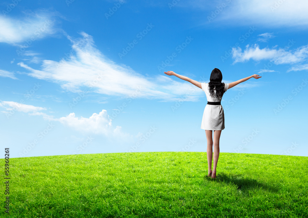 field of grass and happy young woman field of grass and happy young woman