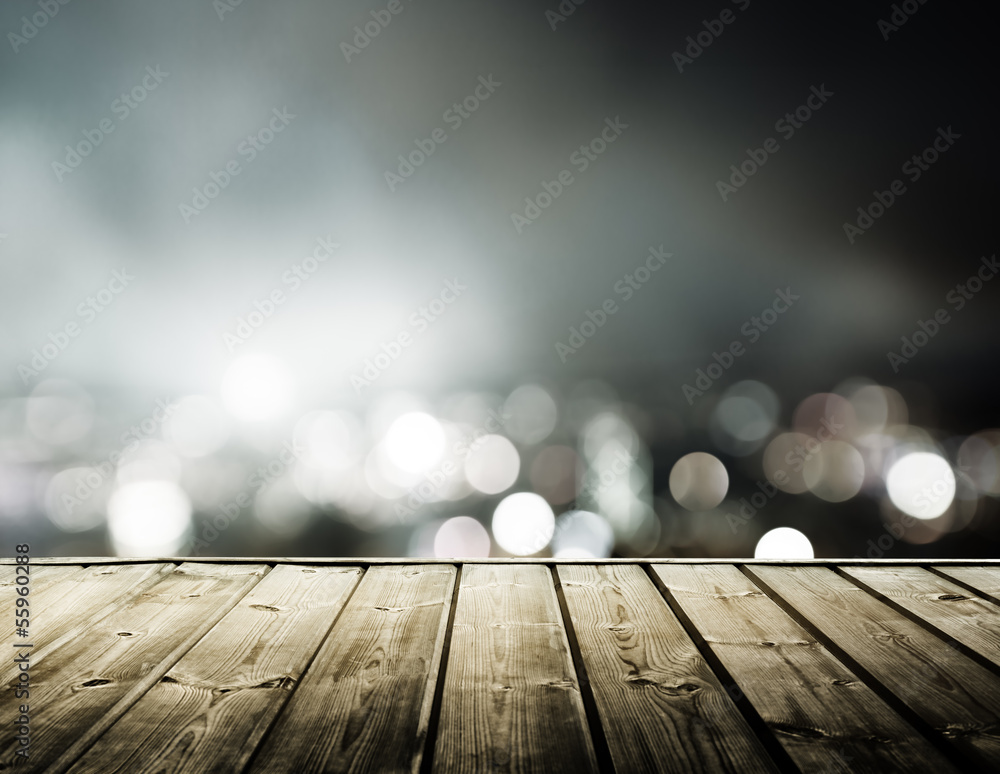 Naklejka premium wooden platform and lights of night Hong Kong