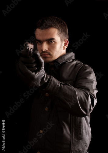 Young man holding a gun