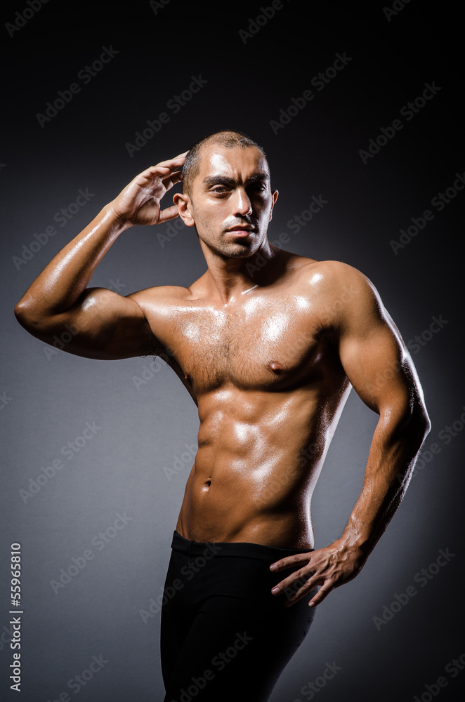 Fototapeta premium Ripped young man in bodybuilding concept