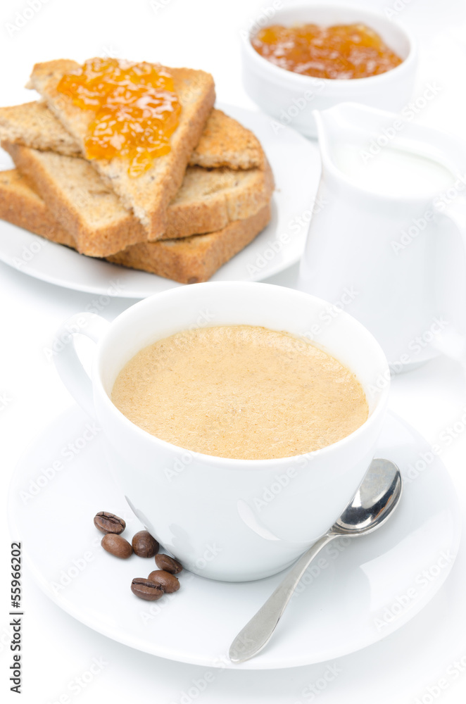 close-up of cappuccino, milk and fresh toast with jam on white close-up of cappuccino, milk and fresh toast with jam on white