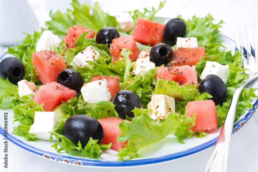 fresh salad with watermelon, feta cheese and olives, close-up fresh salad with watermelon, feta cheese and olives, close-up