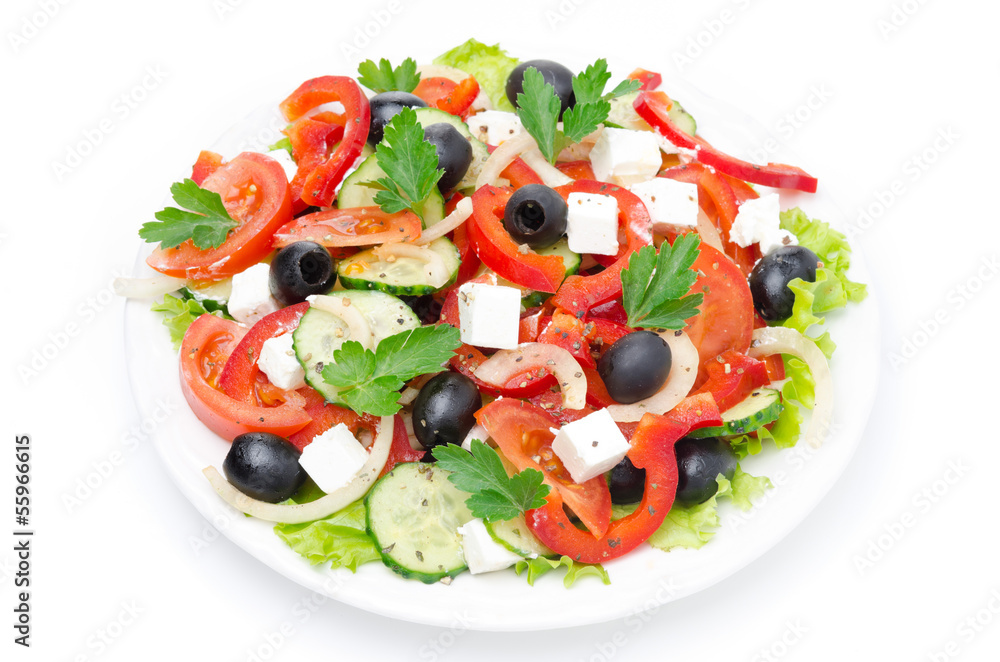 Greek salad with feta cheese, olives and vegetables, top view