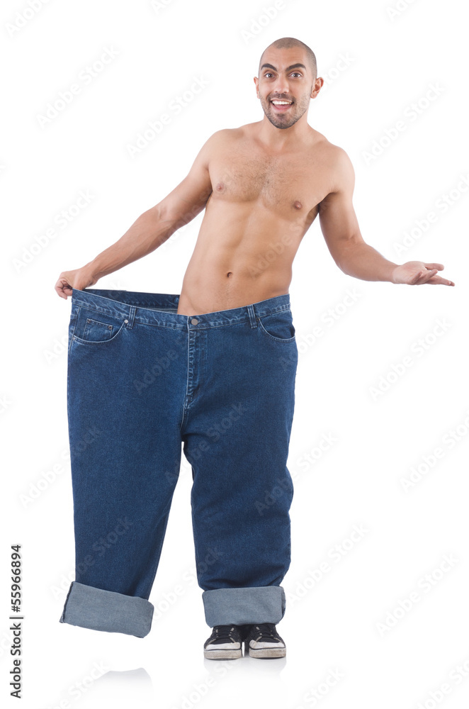 Fototapeta premium Man in dieting concept with oversized jeans