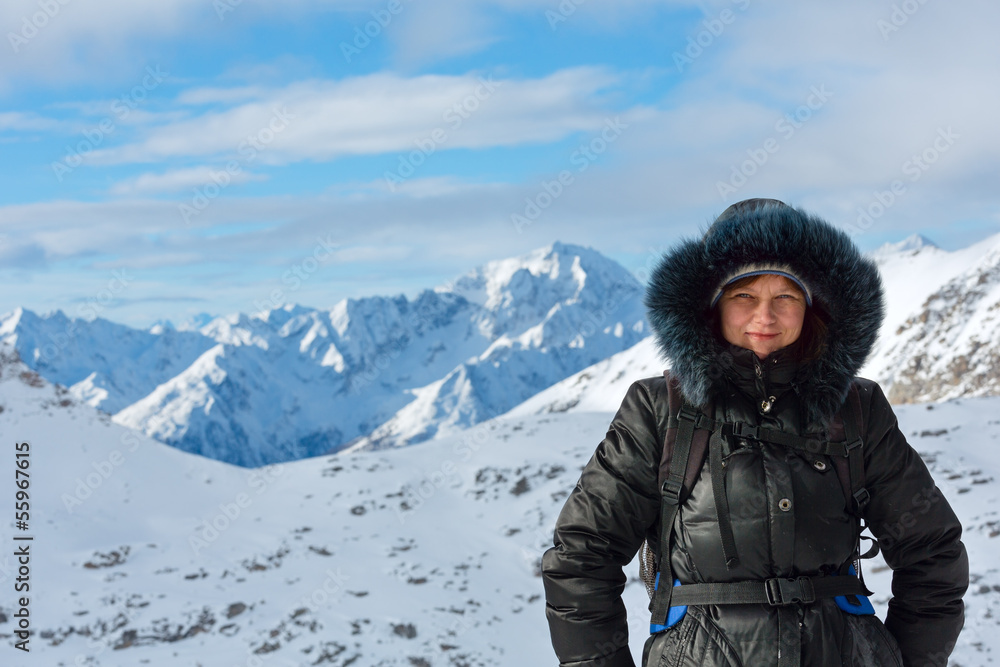 Woman on winter mountain background (Austria).