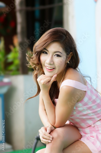 Beautiful young woman posing alone at the outdoor cafe Free Download Beautiful young woman posing alone at the outdoor cafe - GFXLoad
