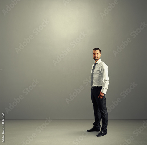 man standing in the grey room