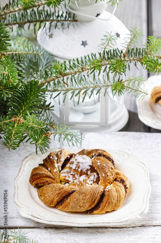 Festive braided bread on wooden table