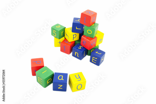 Coloured building blocks with letters on a white background