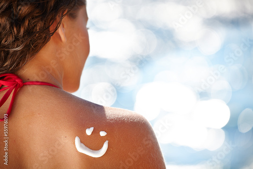 Photography A smile made with suncream at the shoulder (shallow dof)