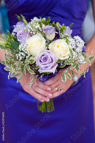 bridesmaid holding a wedding bouquet