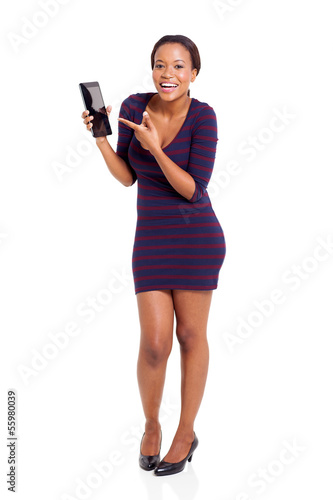 pretty african woman pointing at tablet computer